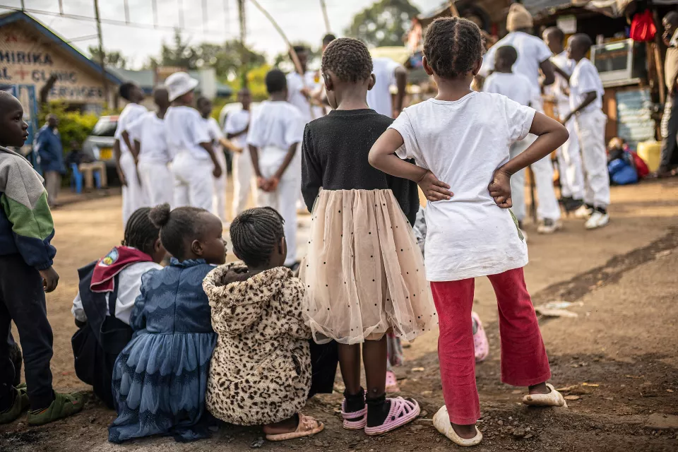 Group of children in white uniforms