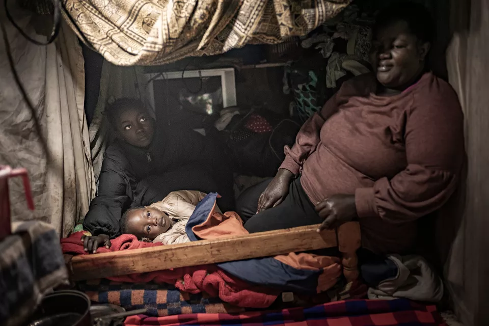 Interior of a simple home with fabric draped from ceiling
