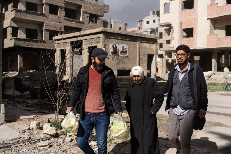 Dr. Khaldoun Muawiyah Al-Mallah, director and founder of The Palestinian House with Yamin Hammeed, volunteer at The Palestinien House. They are helping Yarmouk Makboula Jouriyyeh, whose husband is ill and who stayed in Yarmouk during the siege.