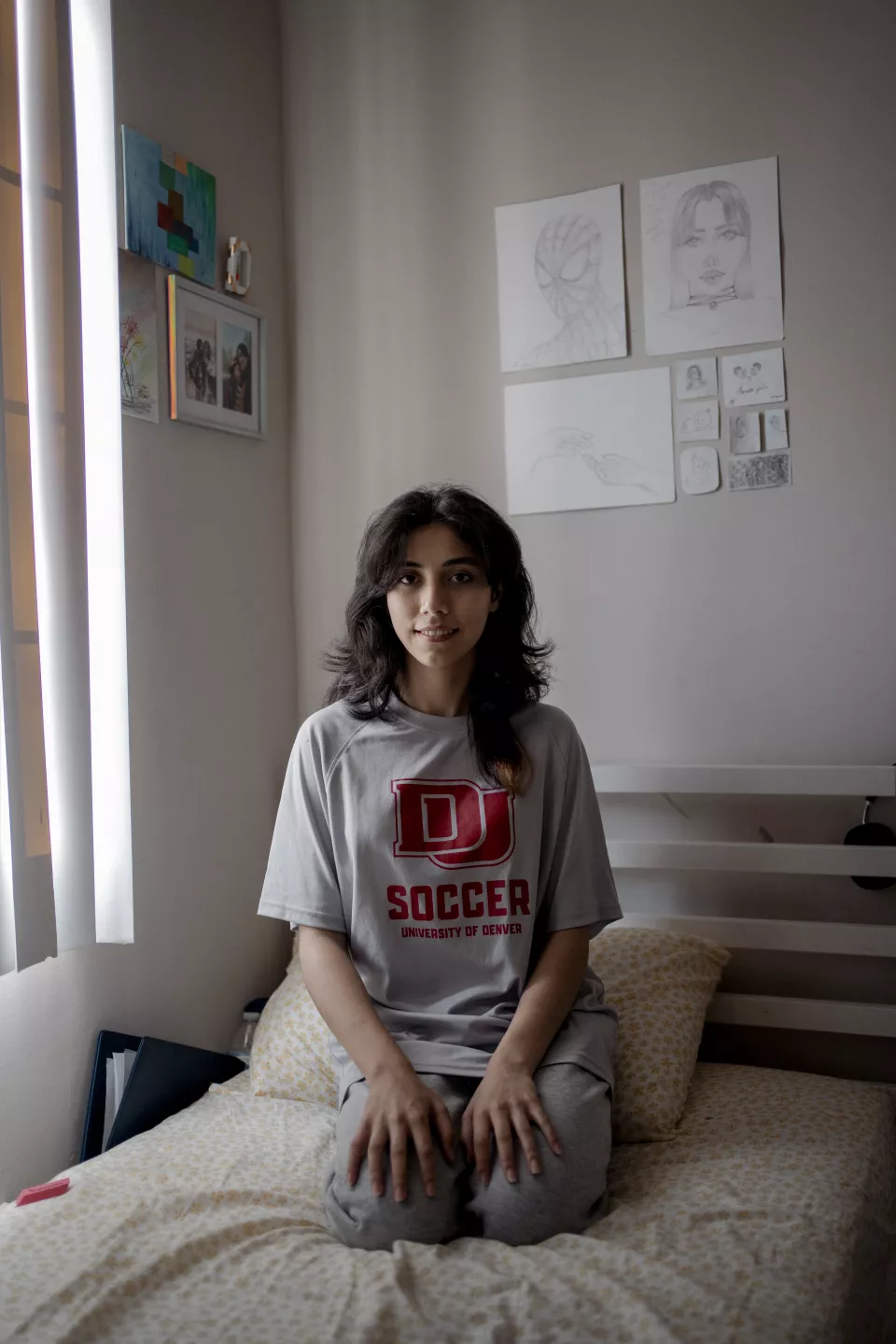 Portrait of S. on her bed, 18 years old is Hakima&rsquo;s cousin. She comes from Afghanistan and lives with her family in the appartement above Hakima&rsquo;s. Silver Spring, Maryland